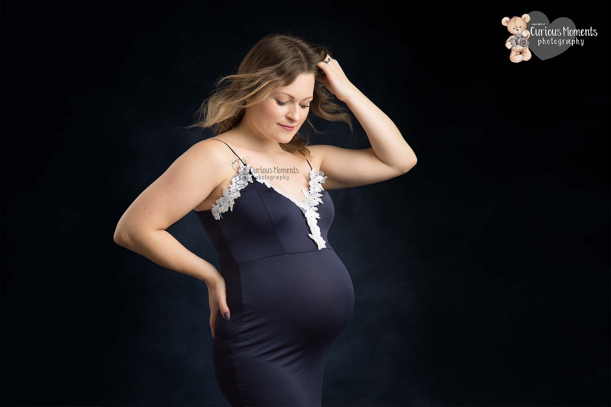 pregnant mum in studio shoot on dark background by Maternity Photographer Carmarthen