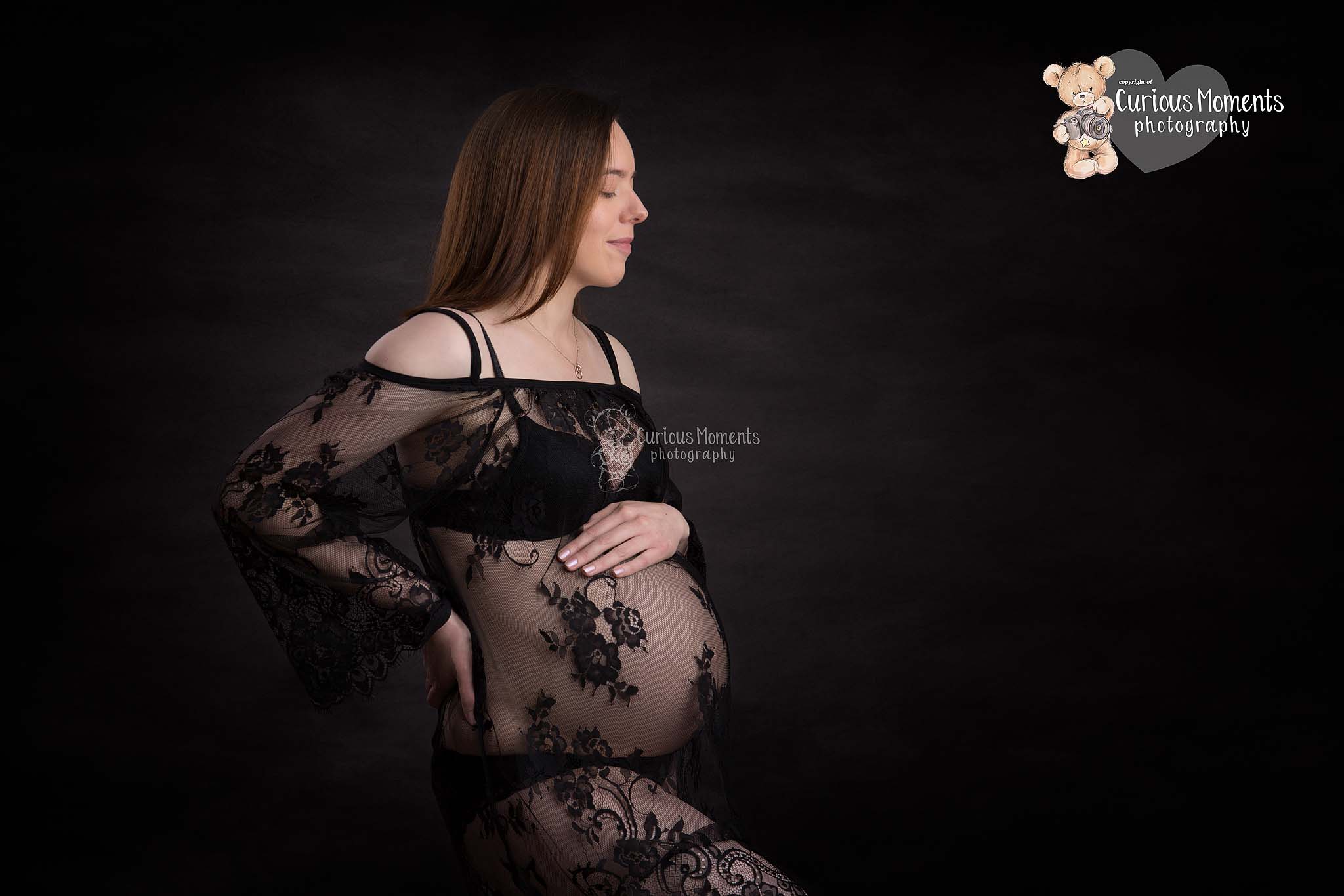 pregnant mummy with black lace dress on black background in photography studio by Maternity Photographer Carmarthen